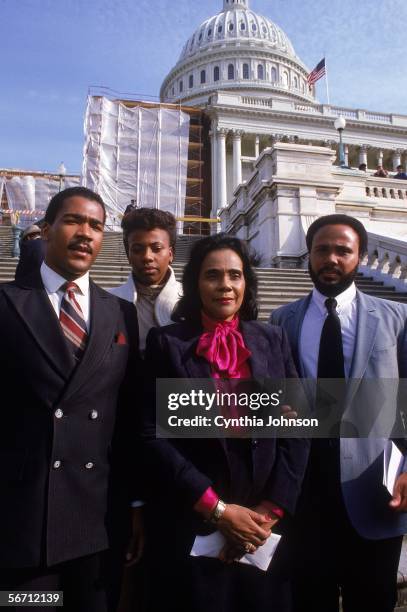 American civil rights campaigner, and widow of Dr. Martin Luther King Jr., Coretta Scott King poses on the steps of the capital building with her...