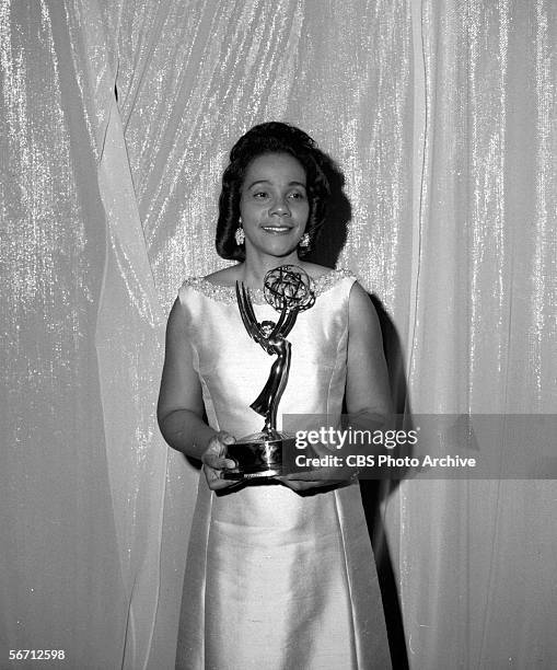 American civil rights activist Coretta Scott King stands in front of a curtain with a statuette at the Emmy Awards, June 8, 1969. Among the...