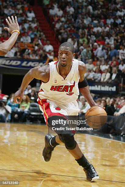 Dwyane Wade of the Miami Heat dribbles against the Minnesota Timberwolves during the game at American Airlines Arena on January 1, 2006 in Miami,...