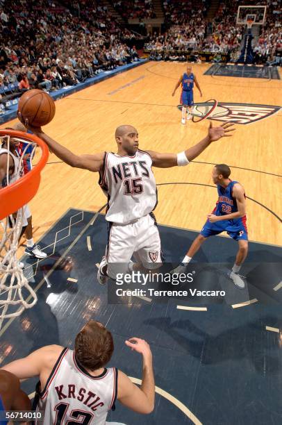 Vince Carter of the New Jersey Nets rebounds against the Detroit Pistons on January 31, 2006 at the Continental Airlines Arena in East Rutherford,...