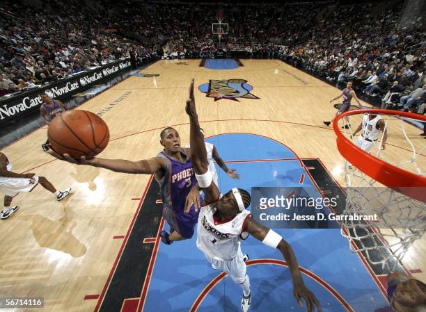 Boris Diaw of the Phoenix Suns shoots against Samuel Dalembert of the Philadelphia 76ers on January 31, 2006 at the Wachovia Center in Philadelphia,...