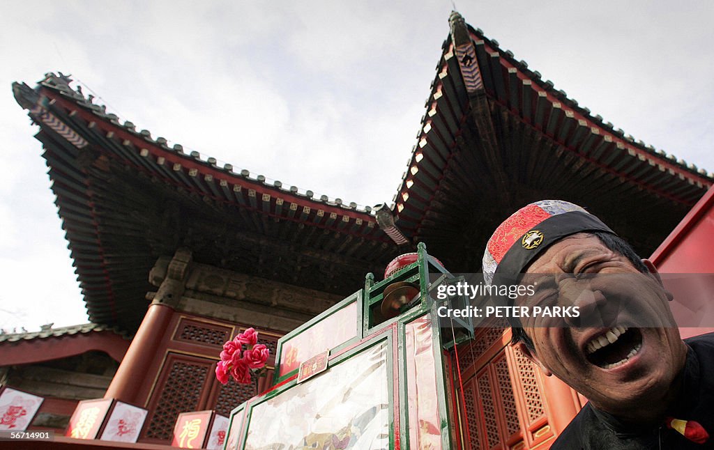 A fortune teller performs as thousands o