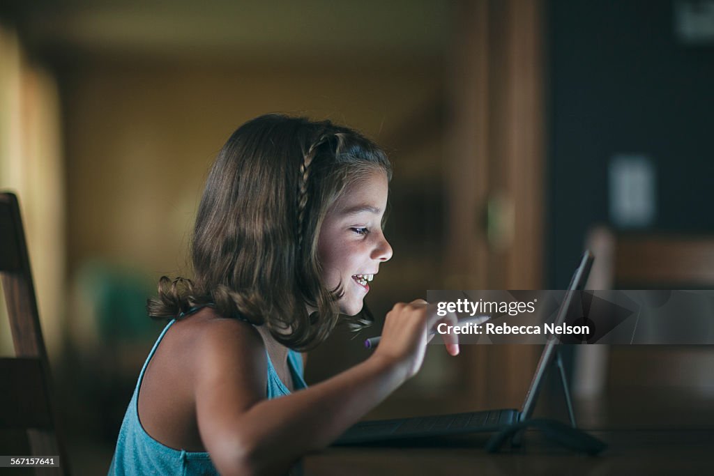 Girl learning to code on a next generation tablet