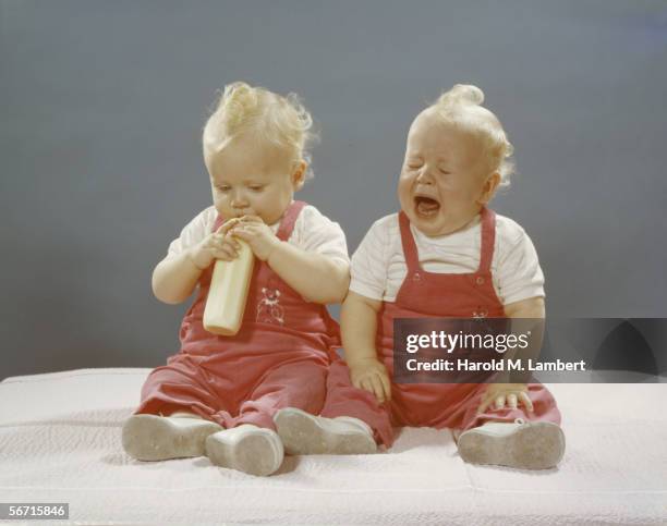 Twin babies have difficulty with the concept of sharing, 1959.