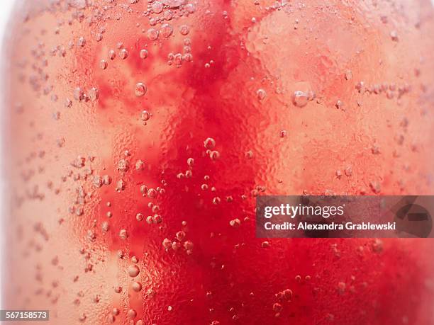 red soda bubbles - sparkling water stock-fotos und bilder