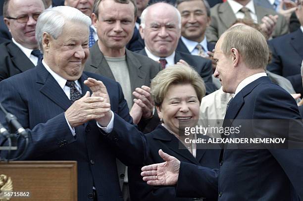 Moscow, RUSSIAN FEDERATION: A picture taken 12 June 2003 shows Russian President Vladimir Putin greeting First President of Russia Boris Yeltsin and...
