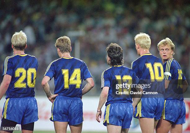 Mats Magnusson, Joachim Nilsson, Anders Limpar, Klas Ingesson and captain Jonas Thern of Sweden line up in a defensive wall during the FIFA World Cup...