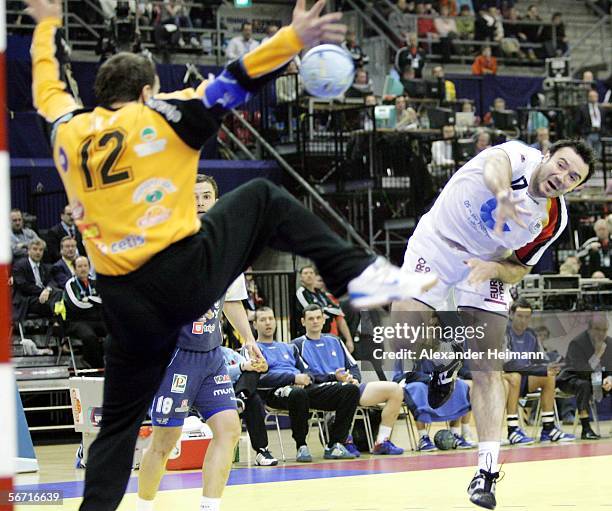 Andrej Klimovets of Germany competes with Gorazd Skof of Slovenia during the Handball Euro06 main round match between Slovenia and Germany on...