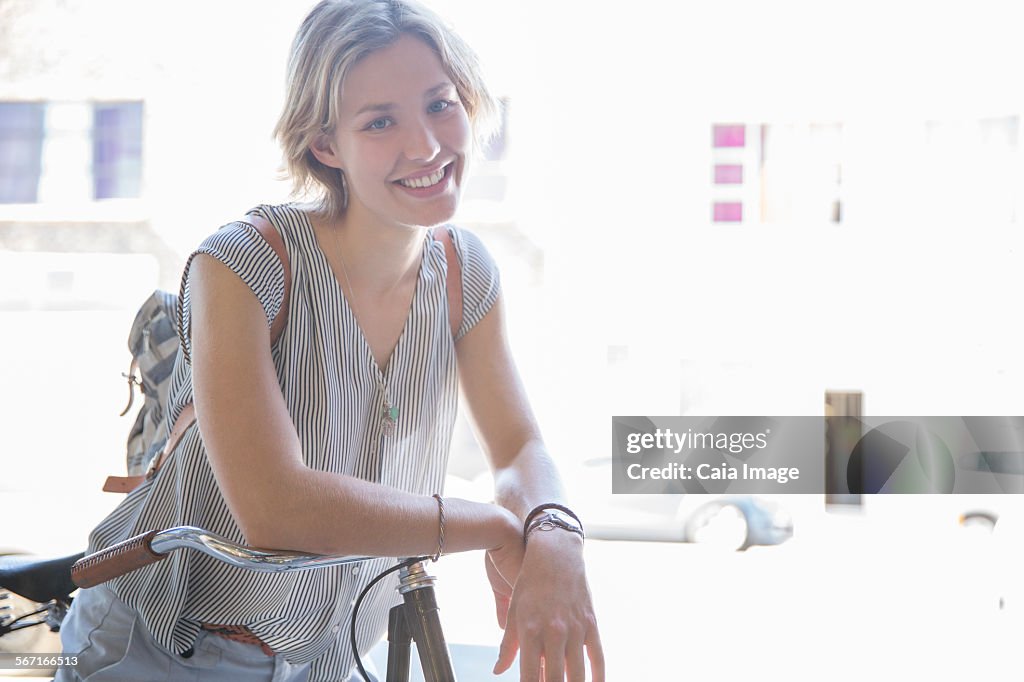 Portrait smiling woman on bicycle