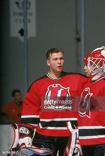 Goalie Martin Brodeur of the Utica Devils talks with Corey Schwab before an AHL game against the New Haven Senators on January 24, 1993 at the New...