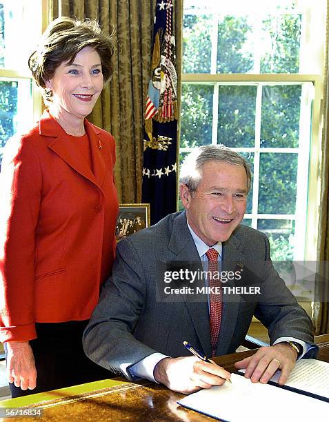 Washington, UNITED STATES: US President George W. Bush and first lady Laura Bush participate in the signing of the Presidential Proclamation in Honor...