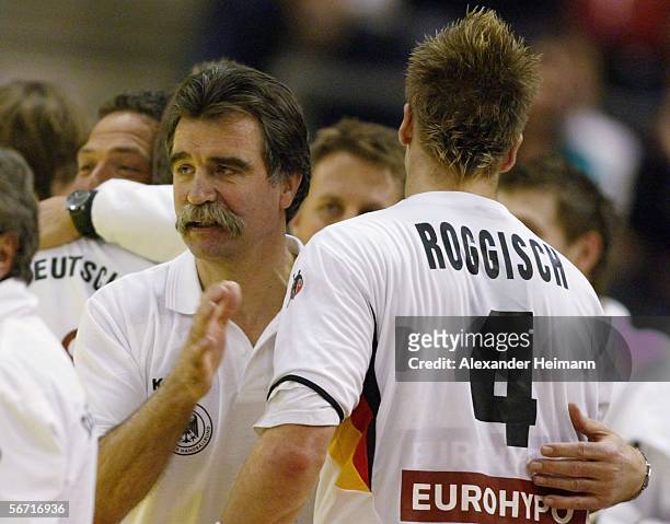 Headcoach Heiner Brand and Oliver Roggisch of Germany celebrate their victory in the Handball Euro06 main round match between Slovenia and Germany on...