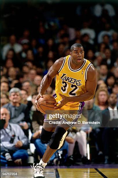 Magic Johnson of the Los Angeles Lakers dribbles the ball upcourt against the Utah Jazz during an NBA game at the Staples Center on February 4,1996...