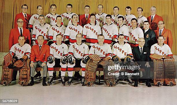 Team portrait of professional hockey team the Baltimore Clippers as they pose on the ice, 1968 or 1969. Front row from left, Marvin Edwards, Robert...