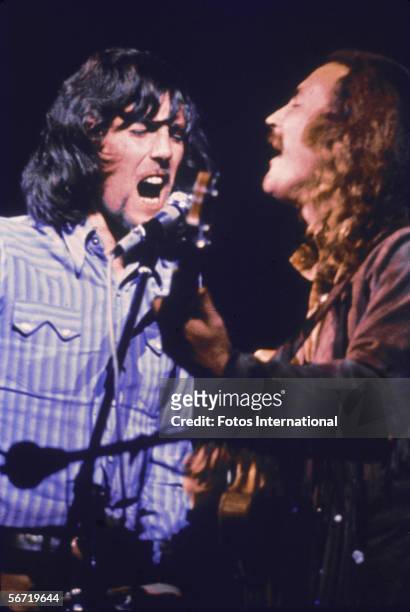 British musician Graham Nash and American musician David Crosby of the group Crosby, Stills, & Nash performs on stage at the Woodstock Music and Art...