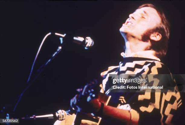 American musician Stephen Stills of the group Crosby, Stills, & Nash performs on stage at the Woodstock Music and Art Festival, Bethel, New York,...