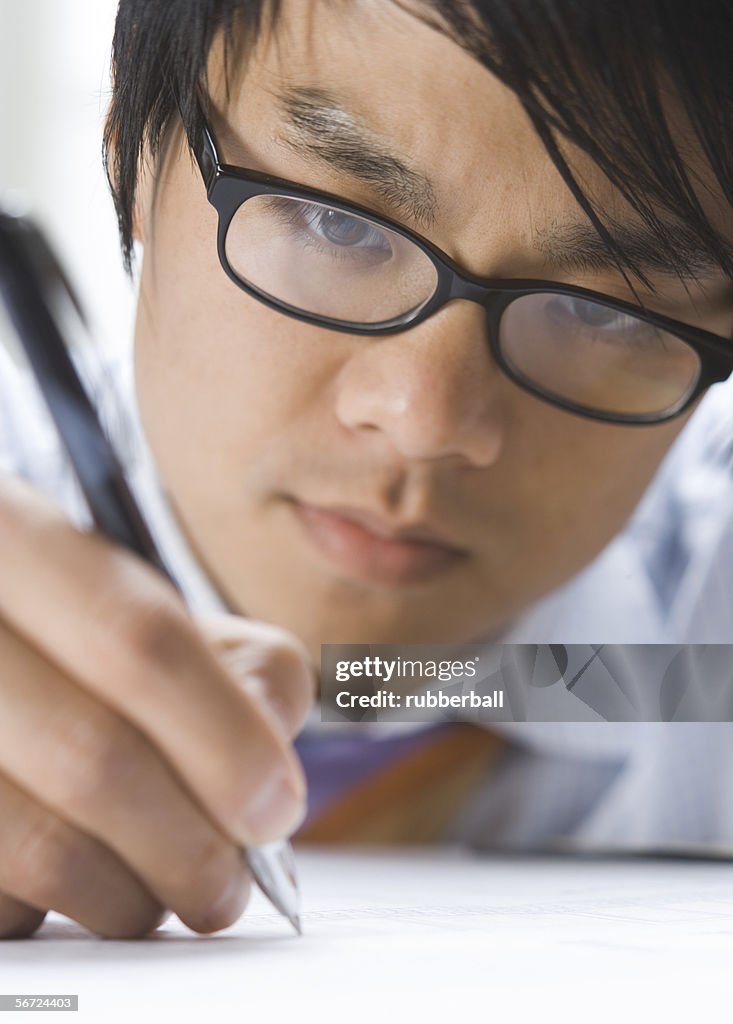 Close-up of a businessman writing