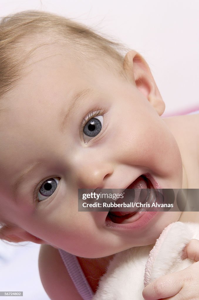 Portrait of a baby boy with mouth open