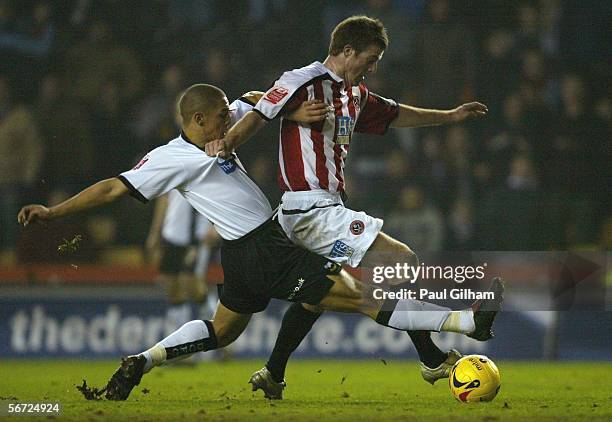 Nathan Doyle of Derby County battles for the ball with Michael Tonge of Sheffield United during the Coca-Cola Championship match between Derby County...