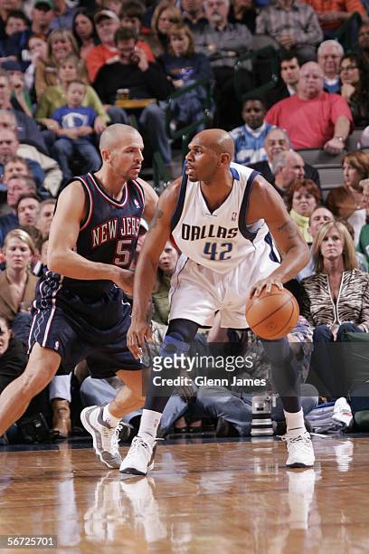 Jerry Stackhouse of the Dallas Mavericks dribbles against Jason Kidd of the New Jersey Nets during the game at American Airlines Arena on January 14,...