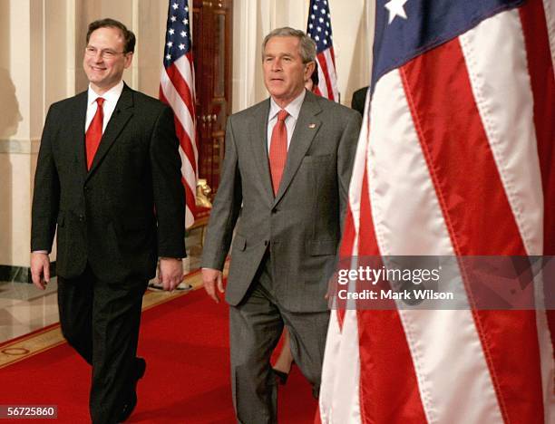 Supreme Court Justice Samuel Alito walks towards the podium with President George W. Bush before he is sworn in as Associate Justice of the United...