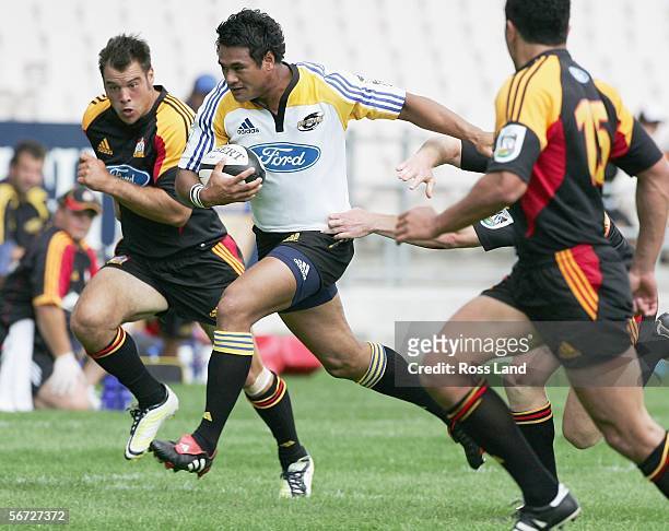 Isaia Toeava of the Hurricanes runs through the defence during the Super 14 rugby pre-season match between the Hurricanes and the Chiefs played at...