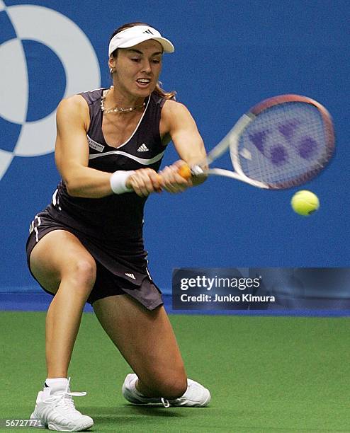 Martina Hingis of Switzerland plays a backhand against Nathalie Dechy of France during the Toray Pan Pacific Open February 2, 2006 in Tokyo, Japan.