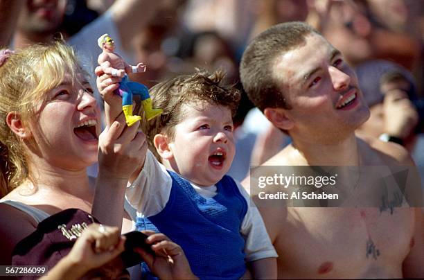 Spectators at the WCW Bash on the Beach World heavyweight championship watch "Sting" of Venice Beach, wrestle along with Hulk Hogan and other...