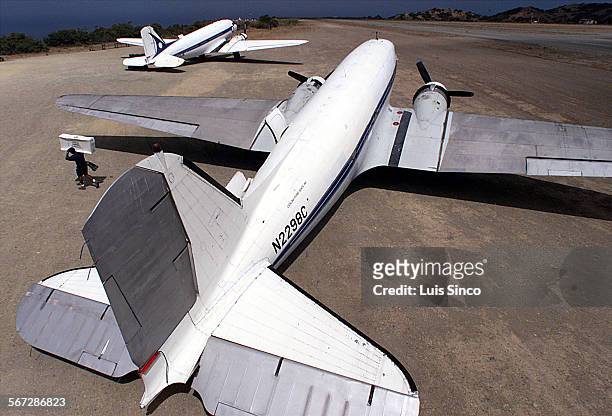 Airline.1.LS. A cargo handler unloads supplies from one of two 55yearold DC3s that Catalina Flying Boats operates between Long Beach and Santa...