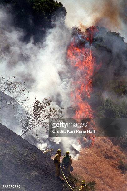 Fire.brush1.KH.5/13/96.Firefighters from the U.S. Forest Service and Riverside County Fire battle a brushfire burning across a ridge away from the 91...