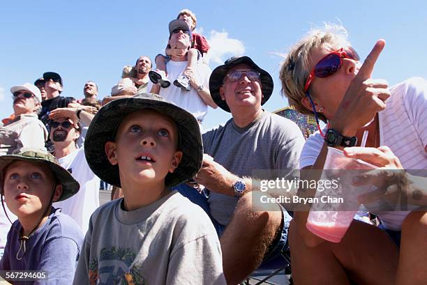 Brothers Kevin and Brent Underwood with parents Glen and Marcia look skyward at the EAA Chapter 723 Air Show and Expo at the Camarillo Airport...