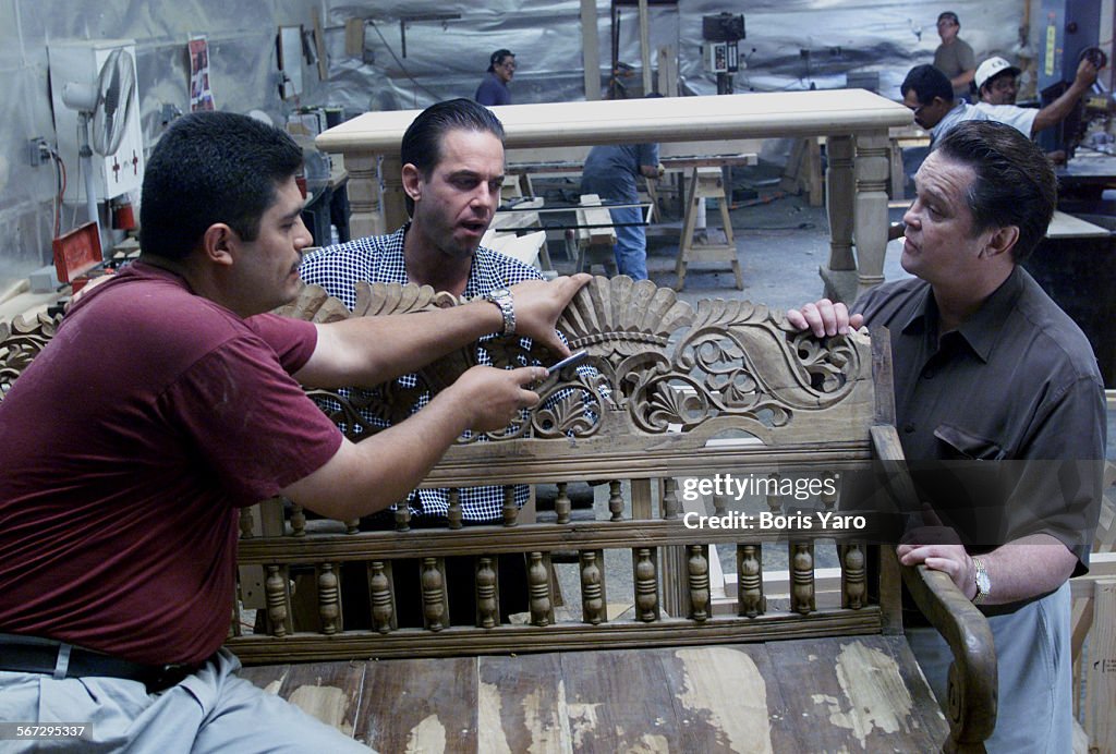 (c and r) Arte de Mexico owners David Stouffers (cq) and Jerry(cq) his father,watch as one of their