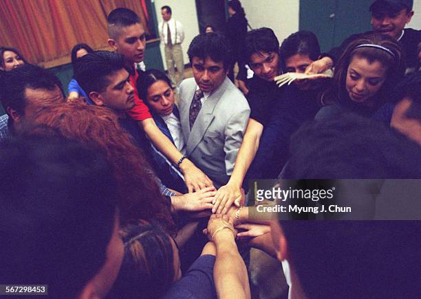 Ivan Olivarez , acting instructor and the head of Constelacion Teatral, ends a recent practice session with a group huddle. He trains the future...
