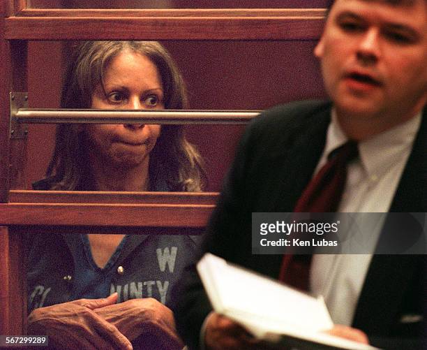 Jean M. Thorbourn, former bookkeeper and chief financial officer at Hebrew Union CollegeJewish Institute of Religion, left, listens to her attorney,...