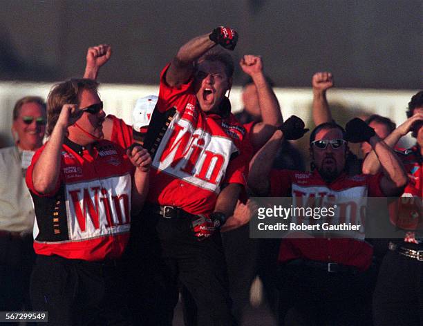 Winternationals at the Pomona Fairgrounds, Sunday, February 6. 001739.SP.0206.drags4 Crew members for Gary Scelzi celebrate a win in the finals of...