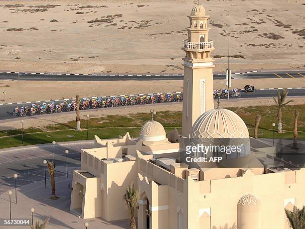 The pack rides past a mosque during the fourth stage of the 5th edition of the Tour of Qatar cycling race between Al Zubarah and Al Khor Corniche, 02...