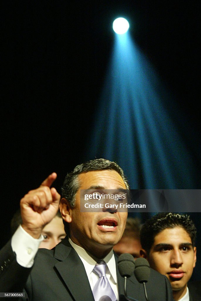 094697.me.0309.villa1.gf Mayoral Candidate Antonio Villaraigosa with his son Antonio Jr., right, spe