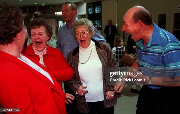 Family.1121.RLSanta AnaAnnie Helisek, far left, of New York, is greeted upon her arrival to John Wayne Airport by her siblings Tinie Van Halen,...