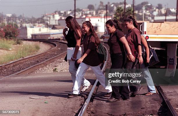 Trains.2.0929.BC.gFrom left to right, Brenda Campos Ernestina Castro Mariana Davalos Veronica Cervantes and Monica Gonzalez walk across the train...