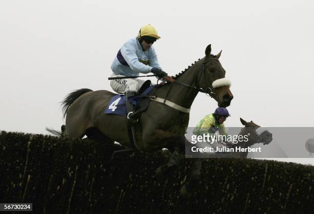 Andy Thornton and See You Sometime lead the Christian Williams ridden Royal Auclaiar over the second last fence before landing The HBLB Cotswold...