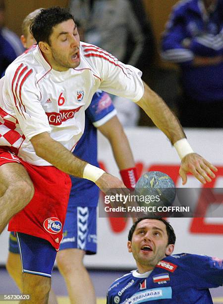 Croatia's Blazenko Lackovic vies with Serbia and Montenegro's Alem Toskic, during their game at the main round of the European handball...