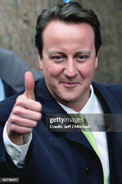 David Cameron, Conservative party leader gestures as he walks down Dunfermline High Street on February 2 in Dunfermline, Scotland. Mr Cameron was...
