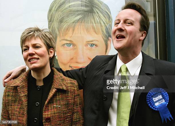 David Cameron, Conservative party leader and Carrie Ruxton walk down Dunfermline High Street on February 2 in Dunfermline, Scotland. Mr Cameron was...