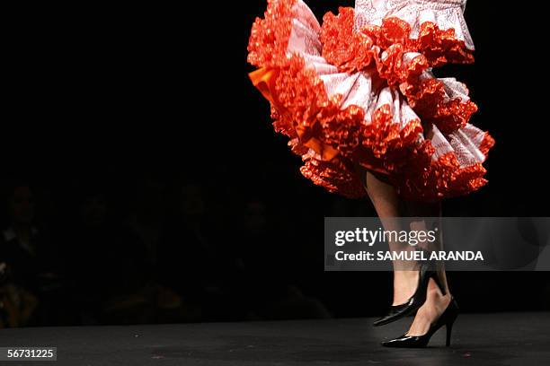 Model presents an outfit by Lole Vera during the XII International Flamenco Fashion Show in Seville, 02 February 2006. AFP PHOTO/Samuel Aranda