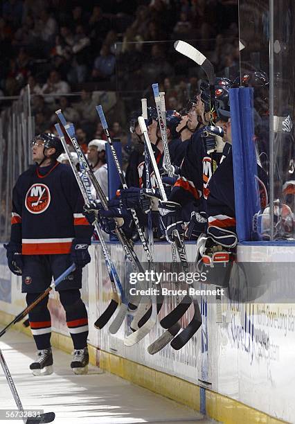 Members of the New York Islanders salute a scoreboard message for teammate Kevin Colley, recuperating from a fractured vertebrae, during the first...