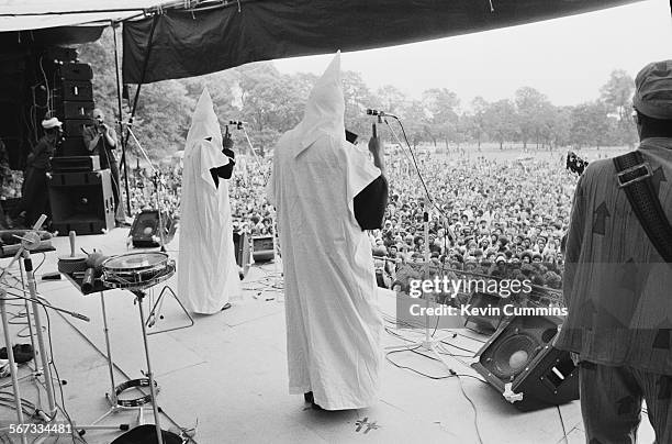 Members of English roots reggae band Steel Pulse performing, in Ku Klux Klan hoods, at the Northern Rock Against Racism Festival in Alexandra Park,...