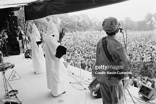 Members of English roots reggae band Steel Pulse performing, in Ku Klux Klan hoods, at the Northern Rock Against Racism Festival in Alexandra Park,...