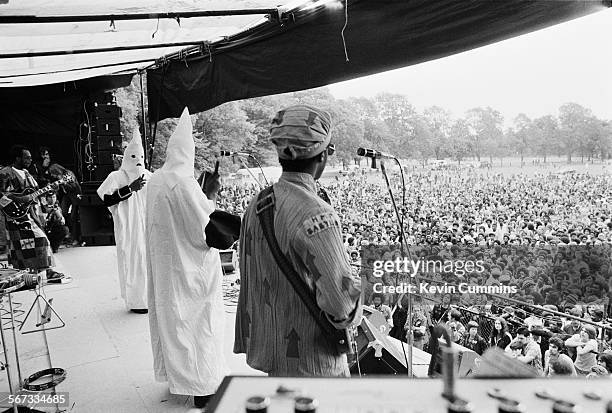 Members of English roots reggae band Steel Pulse performing, in Ku Klux Klan hoods, at the Northern Rock Against Racism Festival in Alexandra Park,...