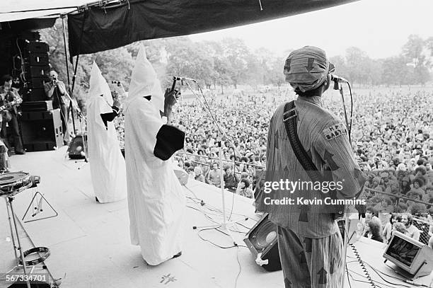 Members of English roots reggae band Steel Pulse performing, in Ku Klux Klan hoods, at the Northern Rock Against Racism Festival in Alexandra Park,...