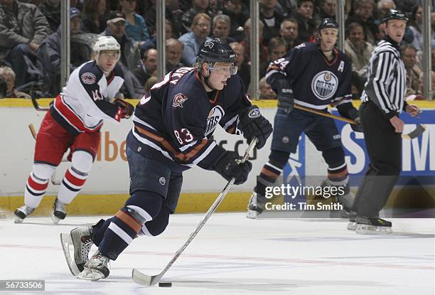 Ales Hemsky of the Edmonton Oilers moves the puck out of the defensive zone as Jaroslav Balastik of the Columbus Blue Jackets and Ryan Smyth of the...